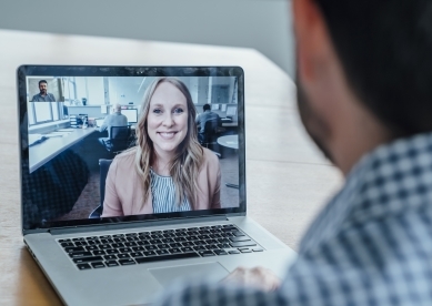 Business Man Virtual Meeting With Woman on Laptop